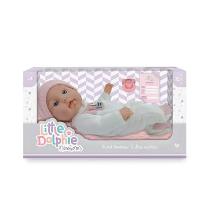 Muñeca recién nacida de 30 cm con cuerpo de vinilo. Incluye cobija, almohada y chupete.