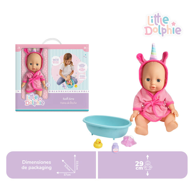 Muñeca de 29 cm con extremidades de vinilo . Incluye tina, esponja, patito de silicona y accesorios en contenedor morado.