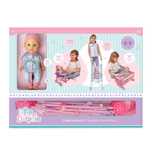Muñeca de 29 cm con extremidades de vinilo . Emite sonidos e incluye coche metálico, silla para comer y cuna